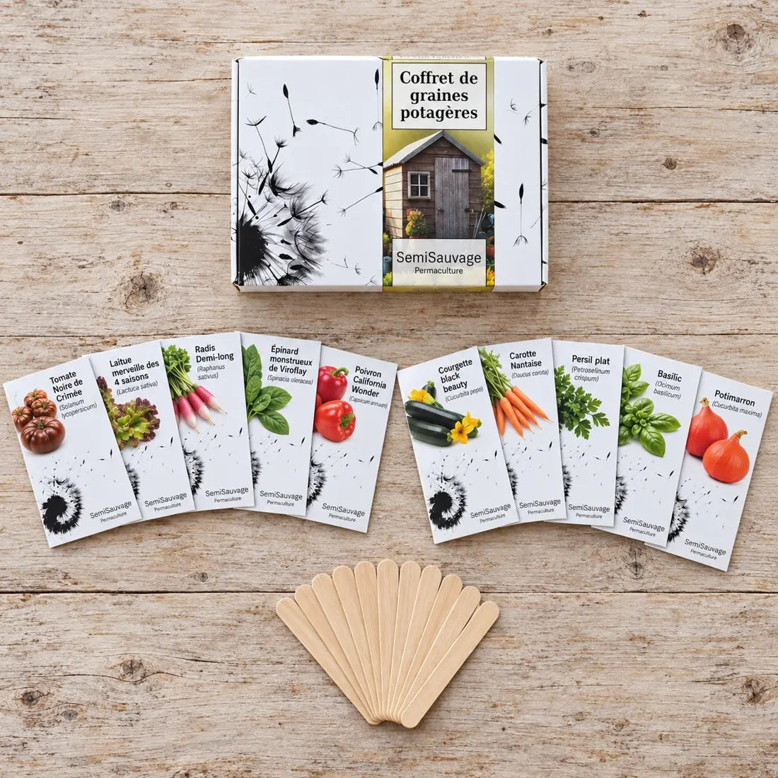 Vue de dessus du coffret Jardinier Débutant SemiSauvage, de ses dix sachets et des étiquettes en bois.